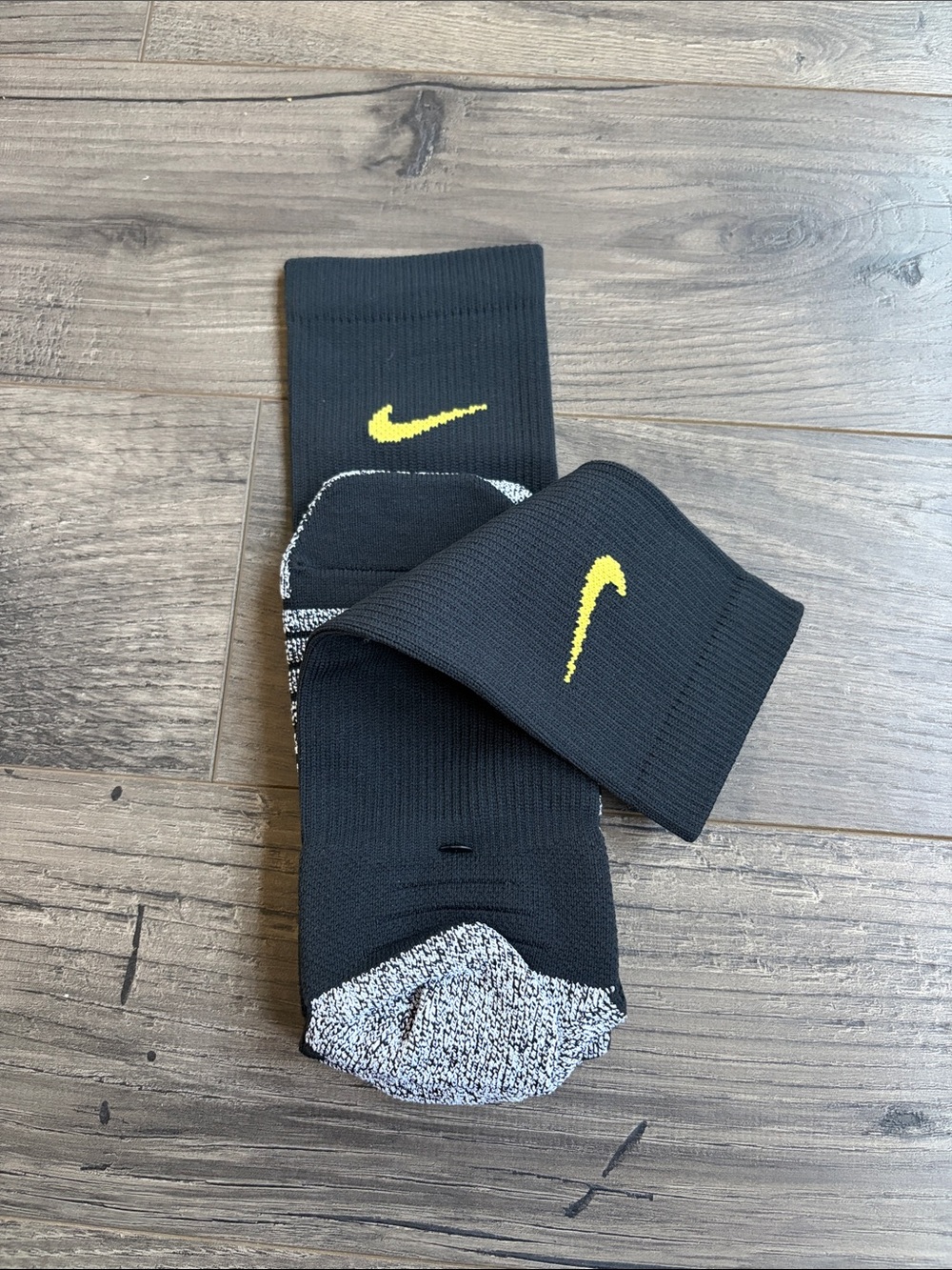 Nike Men’s Black Crew Socks with Yellow Swoosh